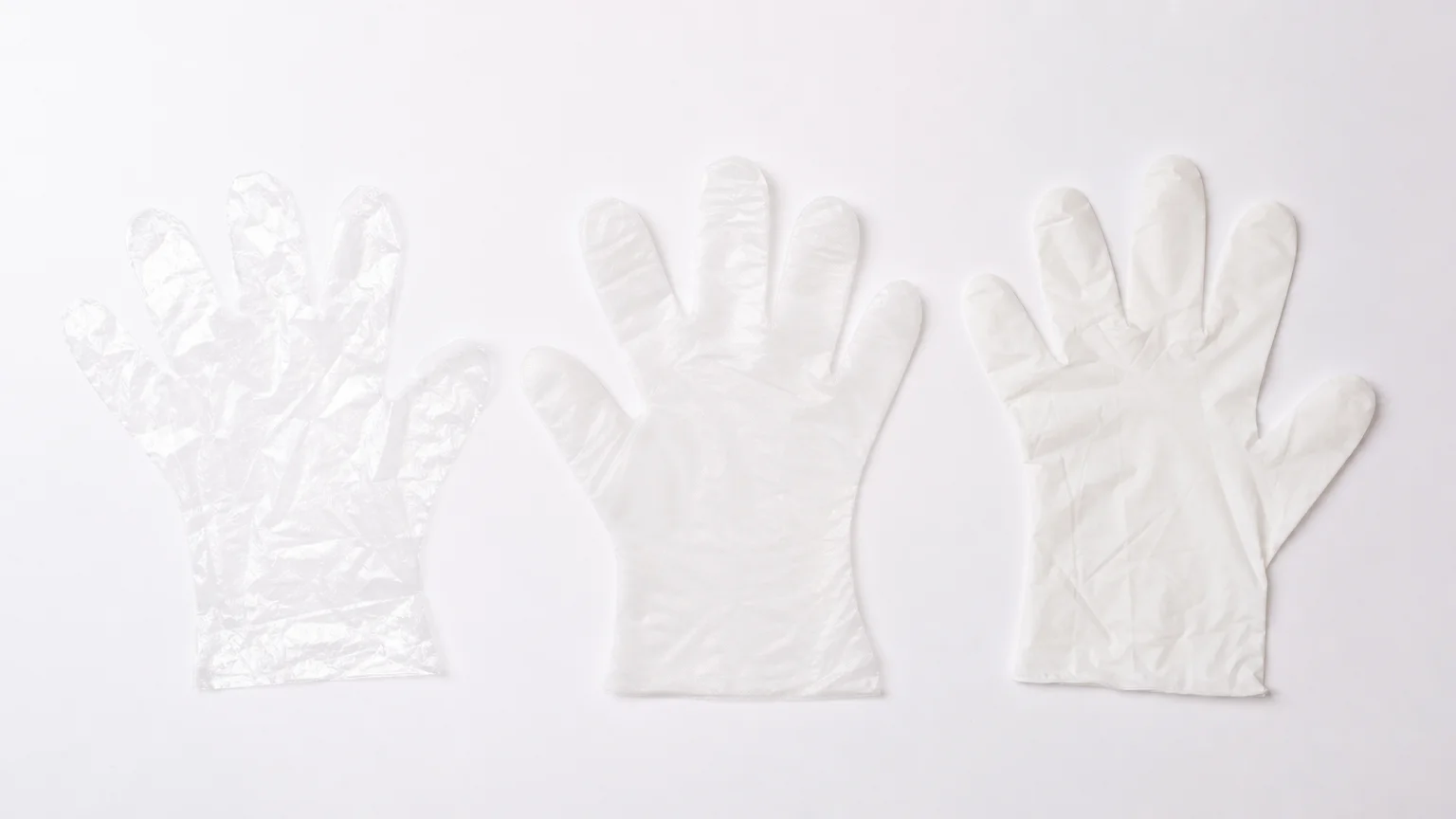 Three types of disposable food gloves compared side by side: thin clear HDPE, stretchy TPE, and thicker CPE for food handling